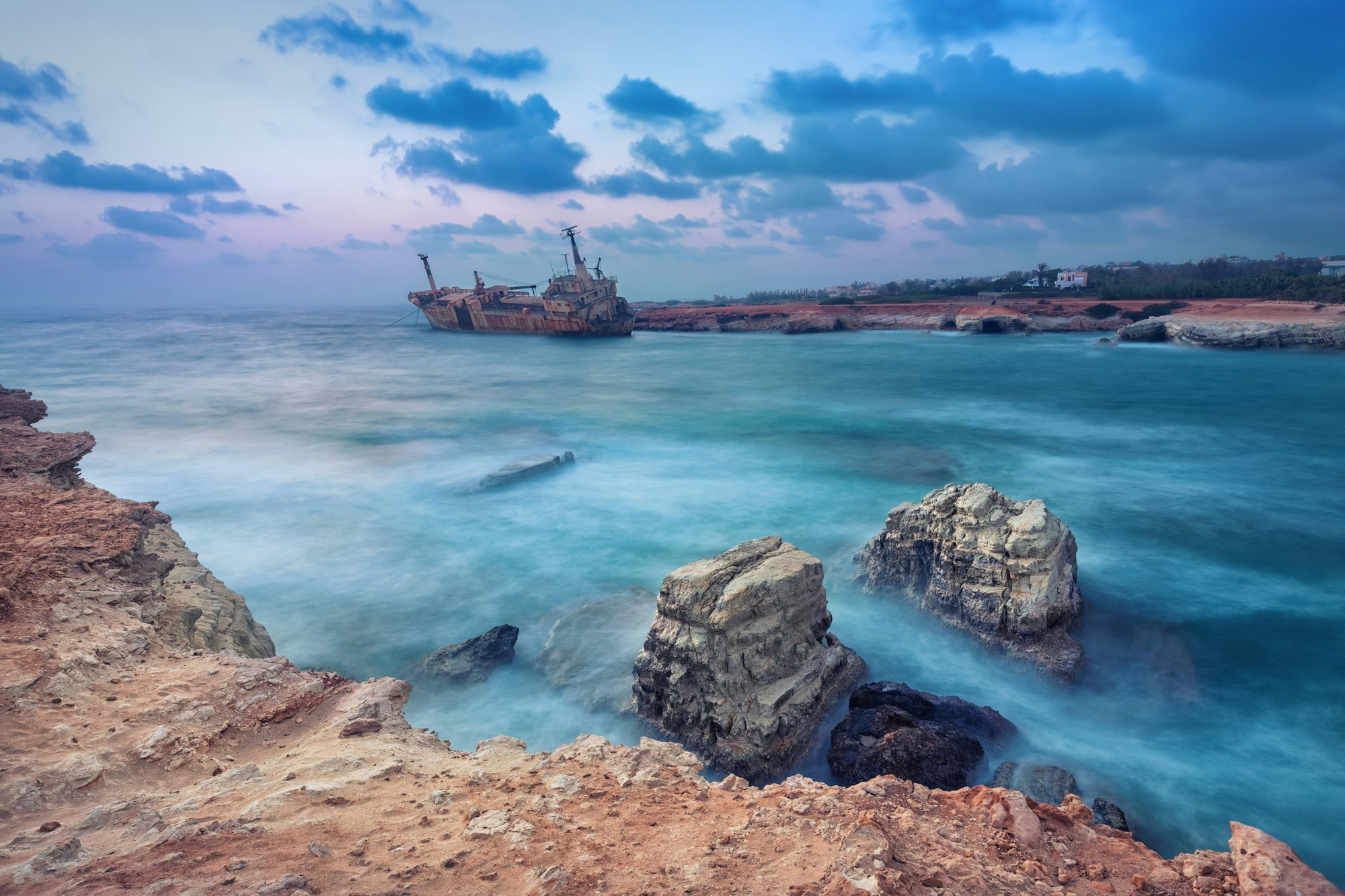 Rocks in sea with abandoned ship, Paphos, Cyprus